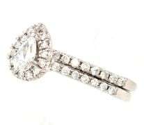 14kt White gold 0.35ct pear shaped diamond halo engagement ring set