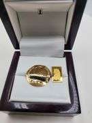 1 gram Suisse fine gold bar and 0.1 gram of gold paper coin