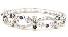 14kt White gold Retro 0.25ctw slightly included diamond and sapphire bangle bracelet