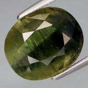 Huge! 7.40ct bi-color pine green Sapphire!