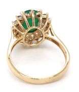 14kt Yellow gold oval emerald and diamond halo ring