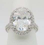 Incredible 6.77CTW Certified Diamond Halo Ring