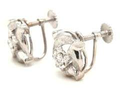 14kt White gold diamond textured flower clip on earrings