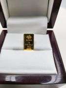 1 gram Suisse fine gold bar and 0.1 gram of gold paper coin