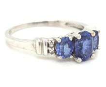 10kt White gold oval tanzanite and diamond 3 stone ring