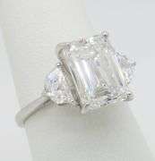 Timeless 4.90CTW IGI Certified Three Stone Diamond Ring