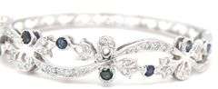 14kt White gold Retro 0.25ctw slightly included diamond and sapphire bangle bracelet
