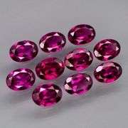 Amazing 9.38ct matched oval cut violet red Garnet set