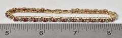 Attractive 10K Yellow Gold Ruby Gemstone and Diamond Bracelet