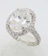 Incredible 6.77CTW Certified Diamond Halo Ring