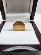 A 1/4 Azadi gold coin