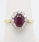 Beautiful 18k Gold Ruby & Diamond Halo ring