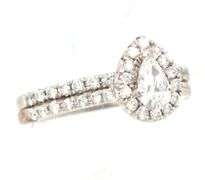 14kt White gold 0.35ct pear shaped diamond halo engagement ring set