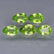 Dazzling 4.81ct untreated apple green Peridot set