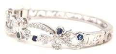 14kt White gold Retro 0.25ctw slightly included diamond and sapphire bangle bracelet