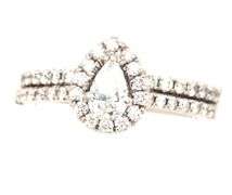 14kt White gold 0.35ct pear shaped diamond halo engagement ring set