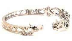 14kt White gold Retro 0.25ctw slightly included diamond and sapphire bangle bracelet