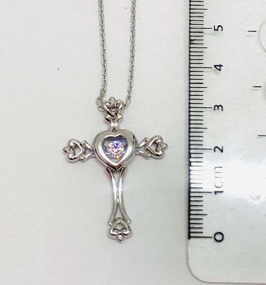 Beautiful Sterling silver Cross pendant with center dancing Moissanite