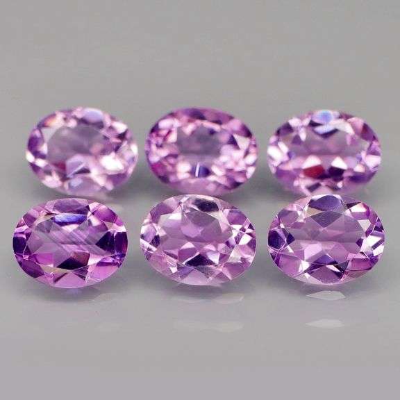 Glittering 9.80ct oval cut Bolivian Amethyst set