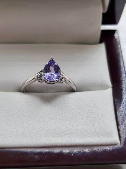 Very fine Tanzanite 1.44 ctw with diamond accent set in silver ring, GIA certified