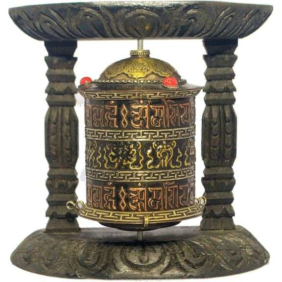 Traditional Tibetan Prayer Wheel on Wooden Stand