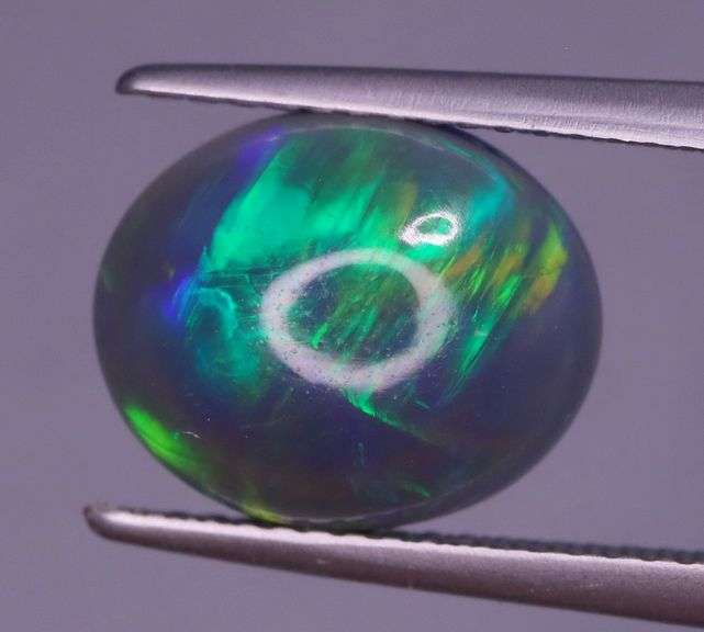 Magnificent 2.48ct full body flashing Semi Black Opal