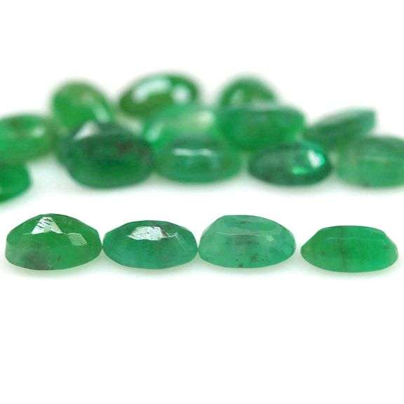Rich emerald green 7.71ct 17pc Emerald set