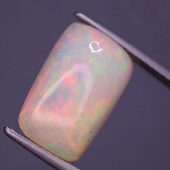 Phenomenal full spectrum flashing 4.81ct semi-black Opal