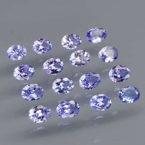 Heavy flashing 2.83ct oval cut Tanzanite set
