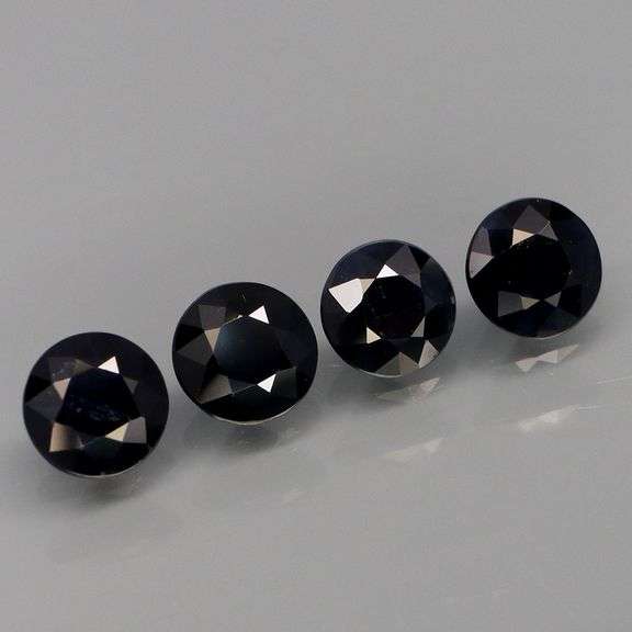 Heated Only! 2.57ct diamond cut black Sapphire set!