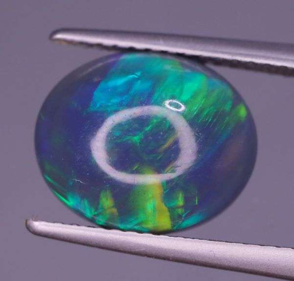 Magnificent 2.48ct full body flashing Semi Black Opal