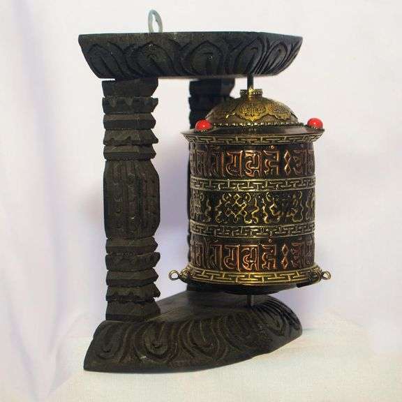 Traditional Tibetan Prayer Wheel on Wooden Stand
