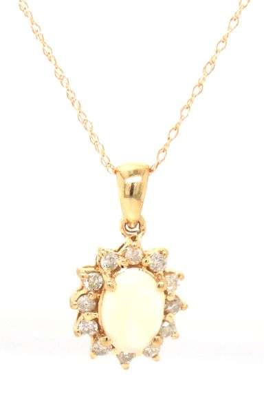 14kt Yellow gold oval opal and diamond halo pendant on chain
