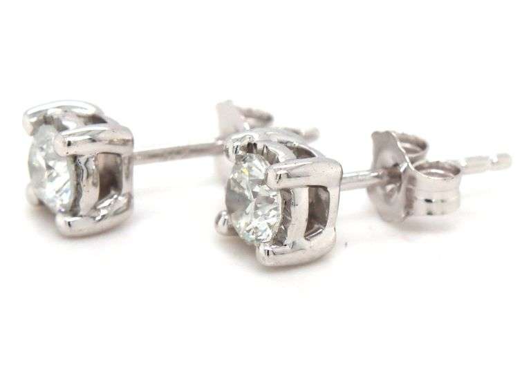 One pair of 14kt white gold 0.60ctw Illusion set diamond stud earrings