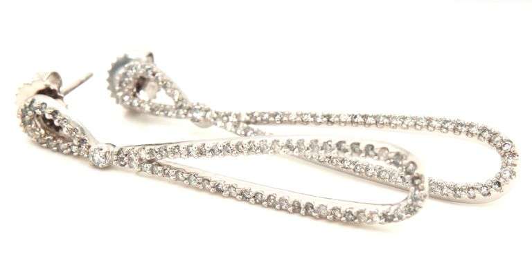 14kt White gold 0.70ctw double tear drop diamond dangle earrings