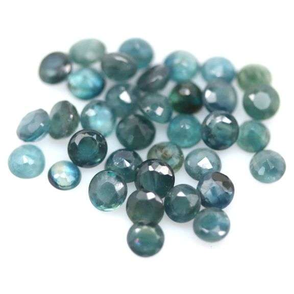 Heated only! 7.76ct blue green Sapphire set