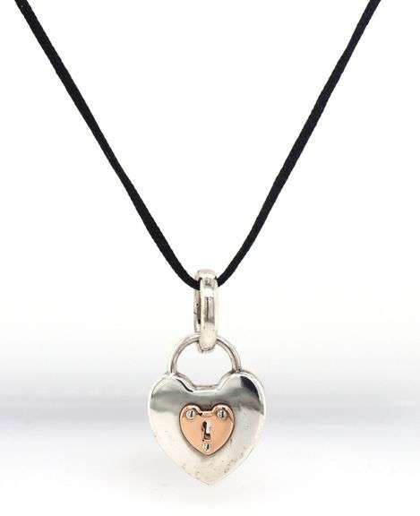 Tiffany & Co two tone Padlock pendant on black cord necklace