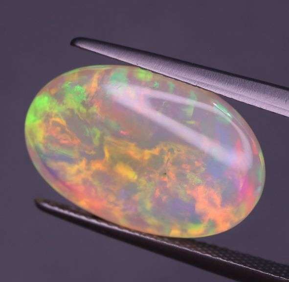 Full body flashing! Vibrant color! 6.99ct semi-black Opal!