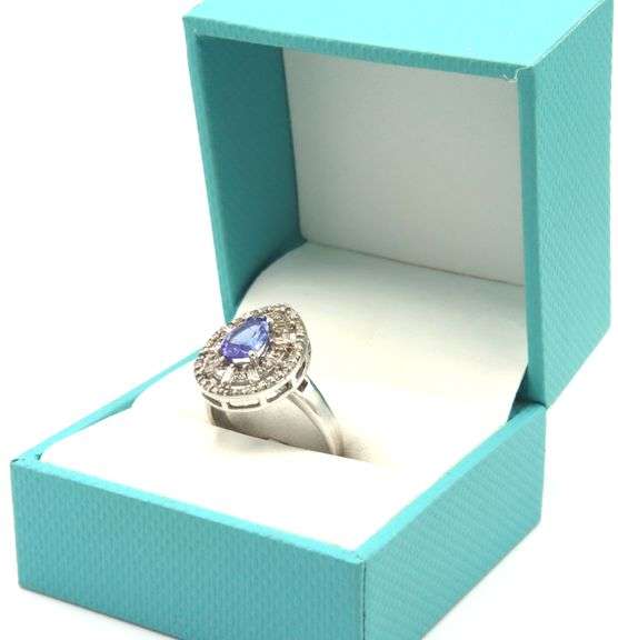 Elegant 1.17CTS Pear Shaped Tanzanite and 0.40CTW Diamond Ring in 14KT White Gold Over Sterling Silv