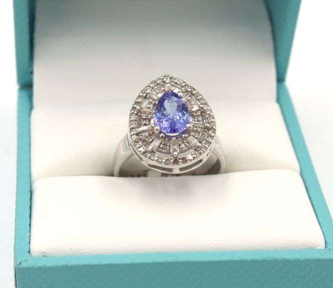 Elegant 1.17CTS Pear Shaped Tanzanite and 0.40CTW Diamond Ring in 14KT White Gold Over Sterling Silv