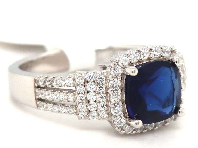 Blue cushion cut and white round cubic zirconia ring in 925 sterling silver