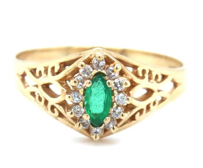 14kt Yellow gold marquise emerald and diamond ring
