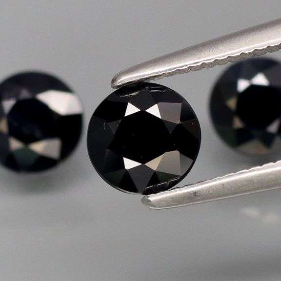 Heated Only! 2.57ct diamond cut black Sapphire set!
