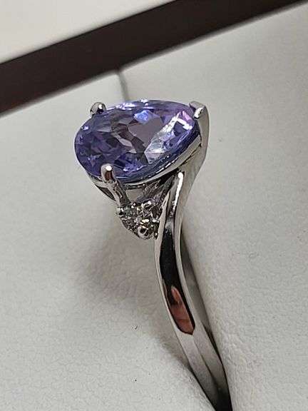 Very fine Tanzanite 1.44 ctw with diamond accent set in silver ring, GIA certified