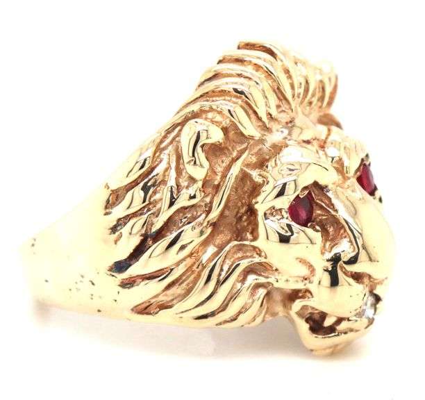 10kt Yellow gold Lion head ring with ruby eyes and diamonds