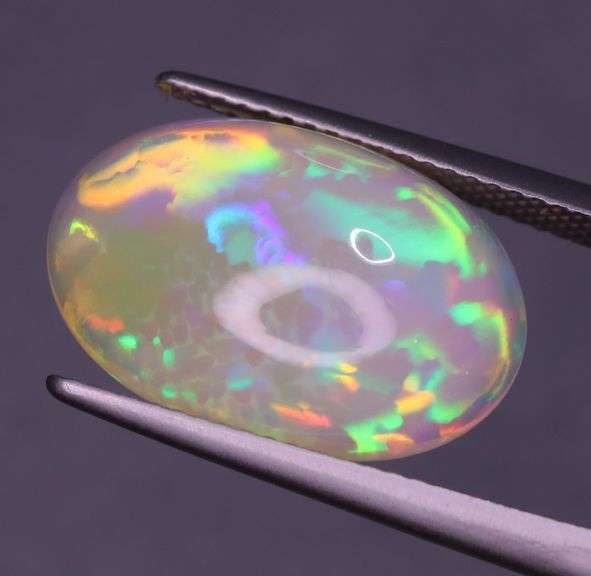 Full body flashing! Vibrant color! 6.99ct semi-black Opal!