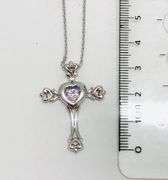 Beautiful Sterling silver Cross pendant with center dancing Moissanite