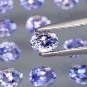 Heavy flashing 2.83ct oval cut Tanzanite set