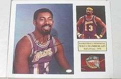 HAND SIGNED WILT CHAMBERLAIN 8X10 MOUNTED IN A 11X14 DISPLAY WITH COA