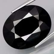 Elegant 27.73ct silky black Loas Tektite